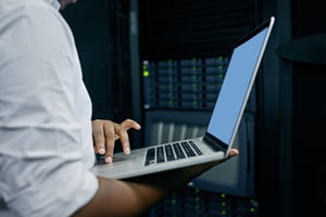 cropped-shot-of-an-it-technician-using-a-laptop-wh-2022-10-04-23-28-50-utc